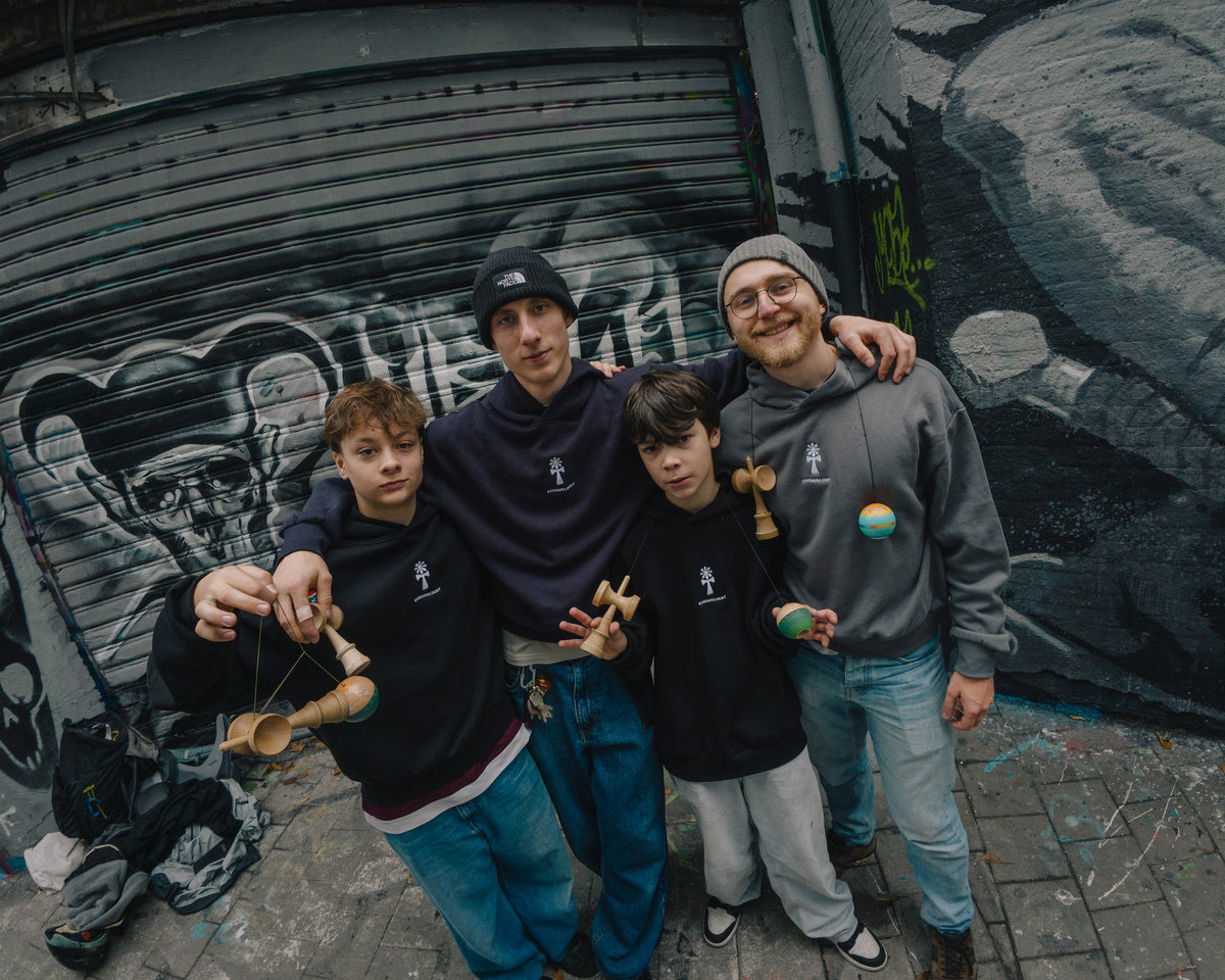 KIN Kendamas crew with kendamas at a graffiti wall in Ghent