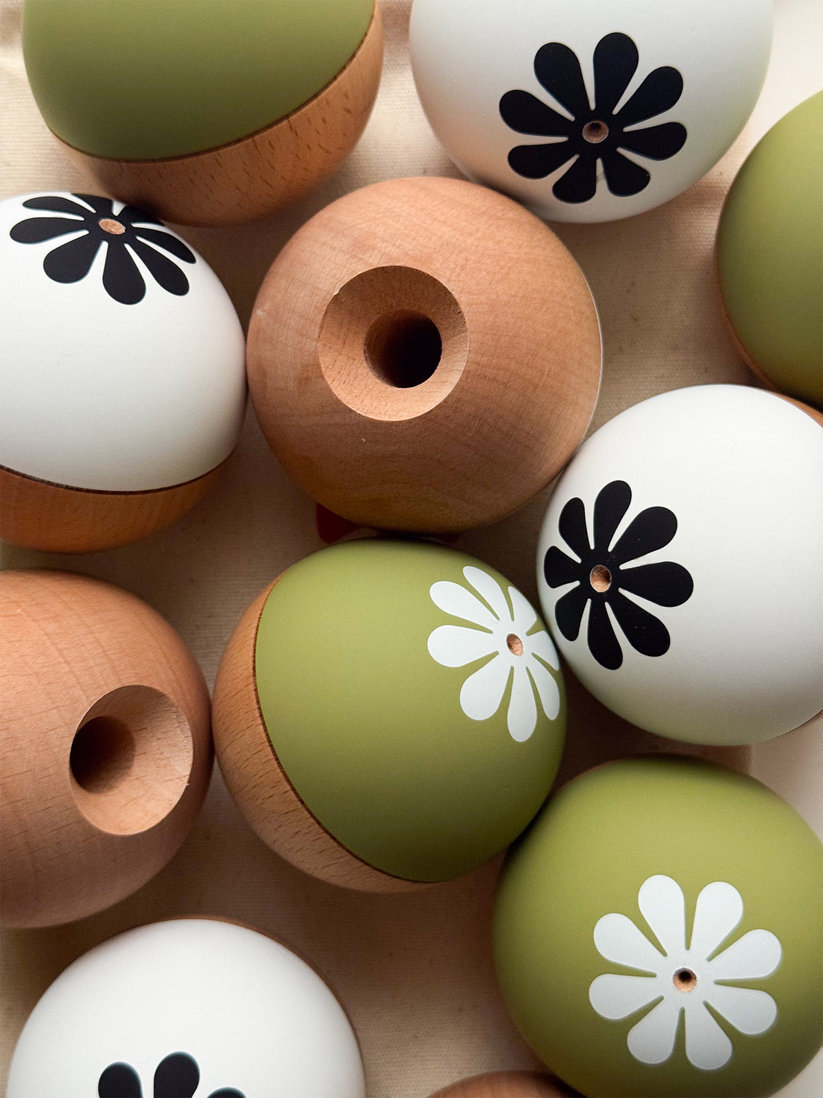 KIN Tama Only replacement tamas in green, white and natural wood with the KIN flower logo